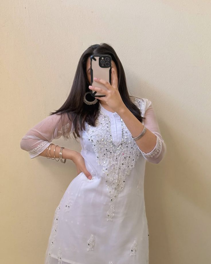 White embroidered kurta for women, perfect for formal and festive occasions.