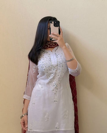 White embroidered kurta for women, perfect for formal and festive occasions.